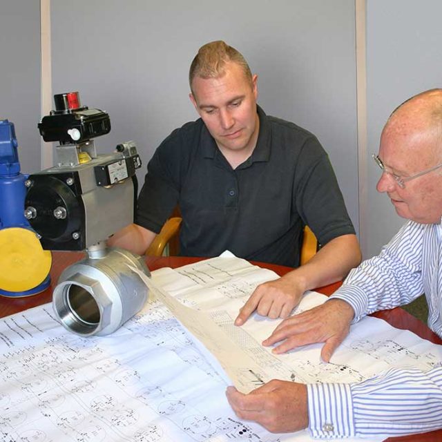 Two men looking at blueprint