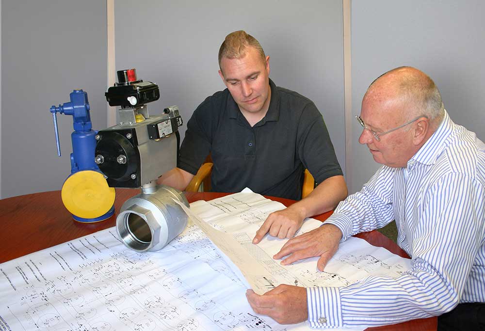Two men looking at blueprint